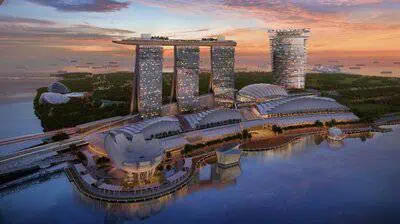 Sands Breaks Ground on New Ultra-Luxury Development in Singapore 2 Rendering of the 55-storey hotel tower and podium with 15,000-seat arena situated adjacent to the existing Marina Bay Sands.