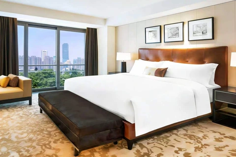Spacious bedroom at The Grand Mansion Hotel Nanjing with mansion-style design and classic luxury furnishings