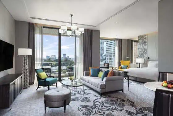 Grand Deluxe Room with king bed and private balcony at Sindhorn Kempinski Hotel Bangkok