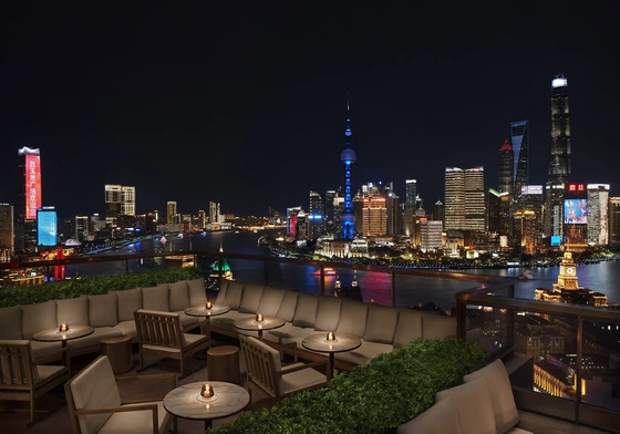 The Shanghai EDITION rooftop at night overlooking Pudong’s illuminated skyline
