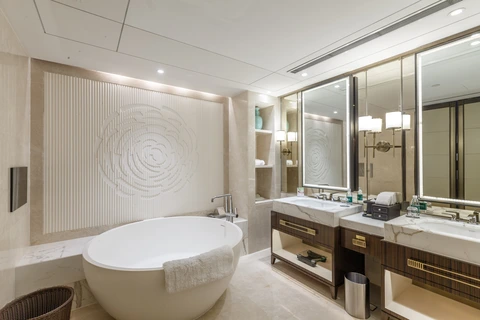 Bathroom at The Grand Mansion Hotel Nanjing with large marble design and deep soaking bathtub