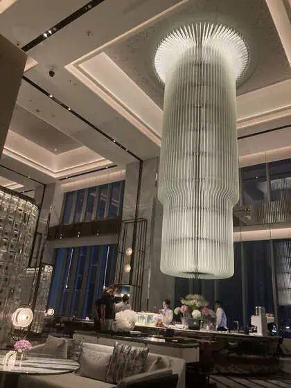 The Ritz-Carlton Wuhan Lobby Lounge at night with warm lighting and city views