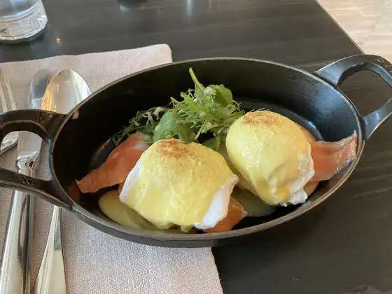 Eggs Benedict with salmon, poached eggs and hollandaise sauce at Waldorf Astoria Bangkok