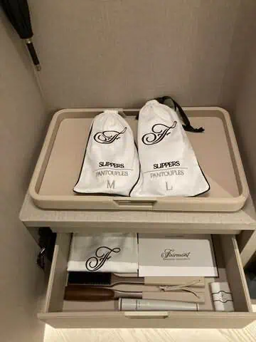 The room included two pairs of slippers in different sizes.