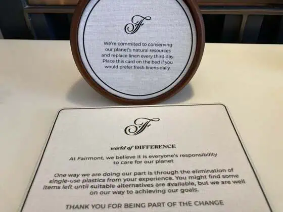 Fairmont World of Difference environmental message beside the bed
