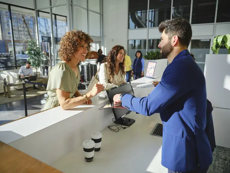 hotel reception guests checking in