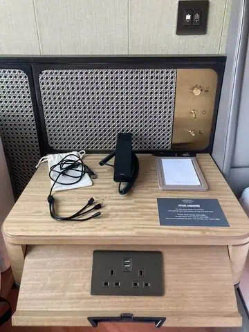 Three-headed charging cable provided in a guest room at Kimpton Tsim Sha Tsui Hong Kong.