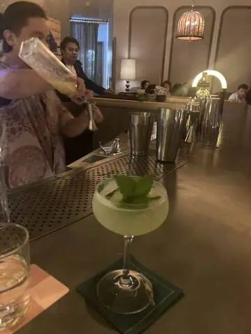 Eastside cocktail with cucumber and mint at Swim Club rooftop bar.