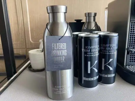 Stainless-steel reusable water bottle in a guest room at Kimpton Tsim Sha Tsui Hong Kong.