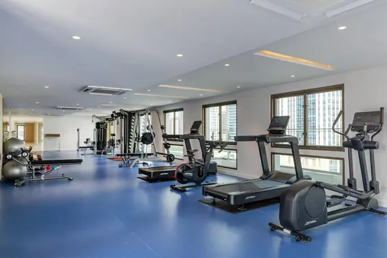 Fitness center at the hotel with modern workout equipment and exercise facilities